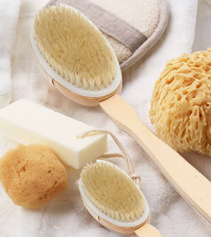 What is the difference between a bath brush and a scrubbing towel?